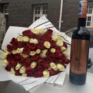 Colourful bouquet and wine