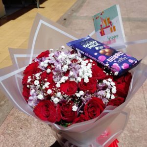 Red roses and a cardbury chocolate