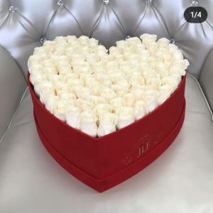 White roses in a heartbox