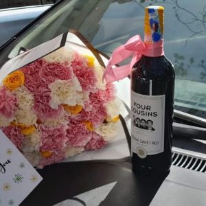 Carnations bouquet and four cousins wine