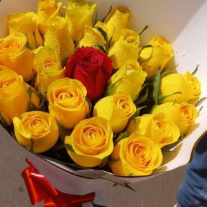 Yellow roses and one red