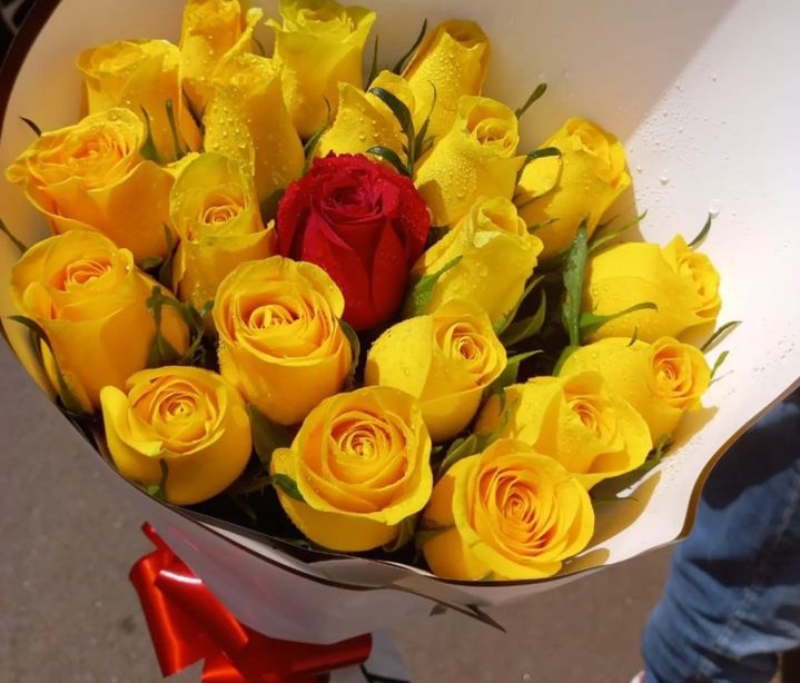 Yellow roses and one red